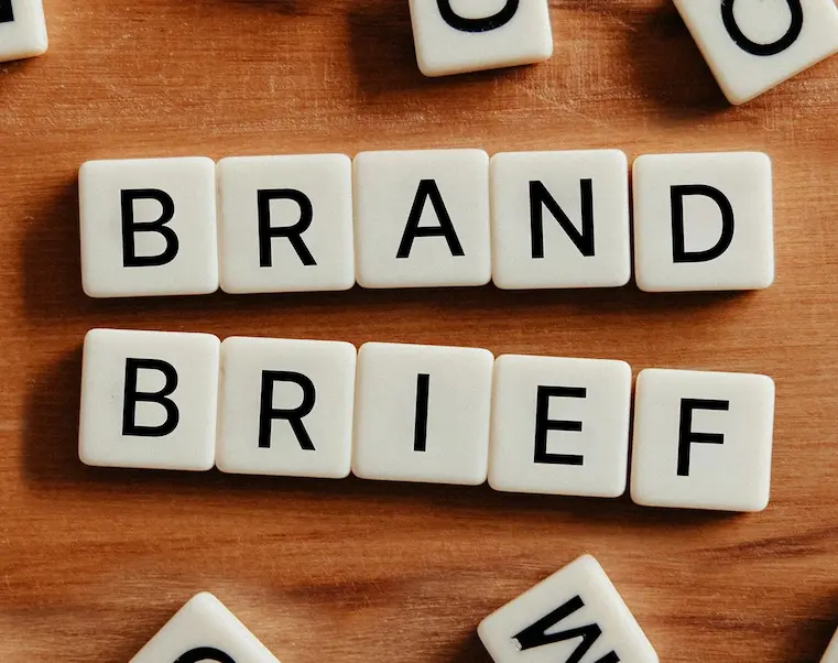 Brand brief words arranged from blocks with letters on the table