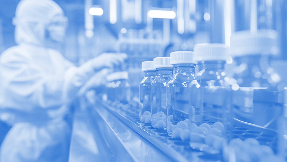 Medicines passing through a production line and specialist standing next to them in a laboratory