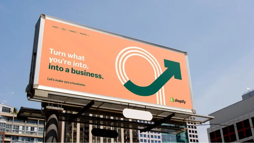 Shopify billboard in a city - turn what youre into, into a business