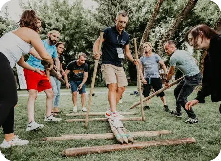 Ziflow CEO Anthony Welgemoed acting as a surfer on wooden logs