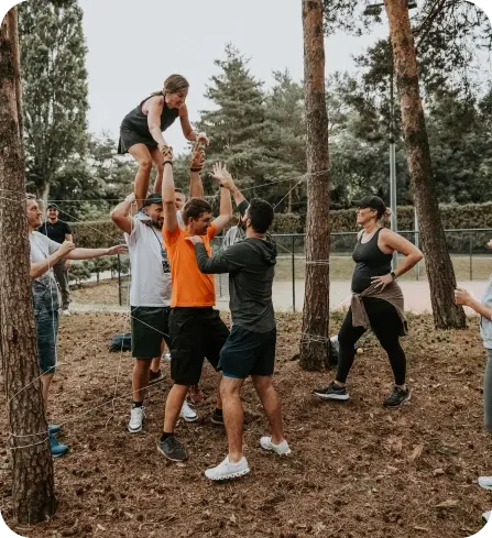 Ziflowians taking part in an outdoors activity transferring people through the net